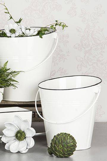 Vit dekorativ hink till blommor